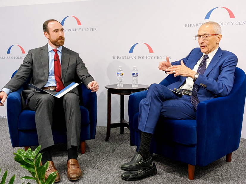 White House Senior Adviser John Podesta (right) talks about permitting reform with Xan Fishman of the Bipartisan Policy Center.