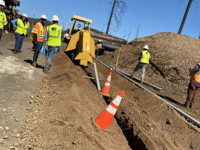 PG&E workers underground power lines near Grizzly Flats, Calif., a rural community leveled by the Caldor Fire in August 2021.