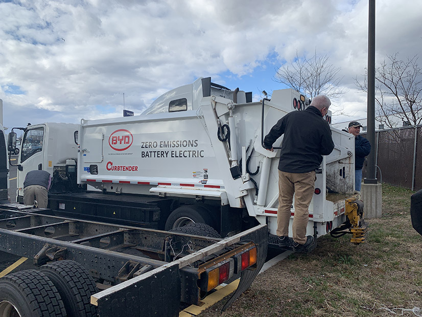 <p><span data-markjs="true" data-ogab data-ogac data-ogsb data-ogsc style=" letter-spacing: normal; orphans: auto; text-align: start; white-space: normal; widows: auto; word-spacing: 0px; color: rgb(36, 36, 36); line-height: 1.2;">George</span><span style=" letter-spacing: normal; orphans: auto; text-align: start; white-space: normal; widows: auto; word-spacing: 0px; color: rgb(36, 36, 36); display: inline !important; line-height: 1.2;"> </span><span data-markjs="true" data-ogab data-ogac data-ogsb data-ogsc style=" letter-spacing: normal; orphans: auto; text-align: start; white-space: normal; widows: auto; word-spacing: 0px; color: rgb(36, 36, 36); line-height: 1.2;">Brew,</span><span style=" letter-spacing: normal; orphans: auto; text-align: start; white-space: normal; widows: auto; word-spacing: 0px; color: rgb(36, 36, 36); display: inline !important; line-height: 1.2;"> Director of the <span style="color: rgb(36, 36, 36); letter-spacing: normal; orphans: 2; text-align: start; white-space: normal; widows: 2; word-spacing: 0px; display: inline !important; float: none;">Woodbridge Township, New Jersey, </span>Department of Public Works, stands on an electric garbage truck purchased with funds from the Regional Greenhouse Gas Initiative.</span></p>