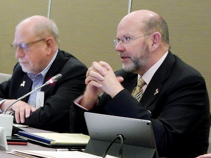 Jim Robb (right) speaks during a NERC meeting.
