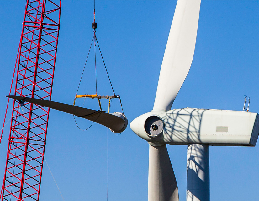 Work is shown at Avangrid's onshore wind farm in Groton, N.H. The company is seeking to alter the financials on a proposed offshore wind farm in neighboring Massachusetts, saying the plan is no longer viable in its current form.