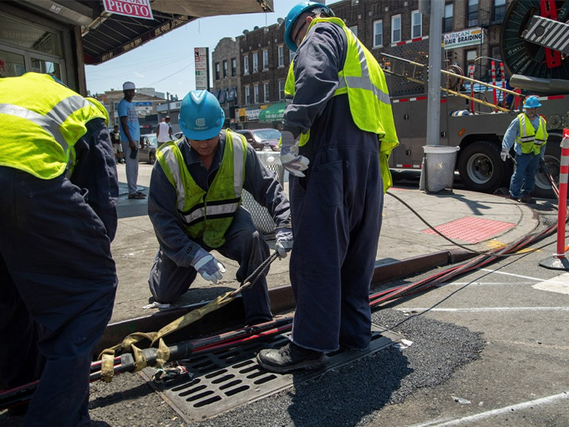 A Con Edison crew responds to an electrical emergency power outage related to a heat wave last summer.