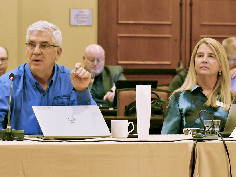 Tom Christensen, Basin Electric, makes a point as SPP CEO Barbara Sugg listens.