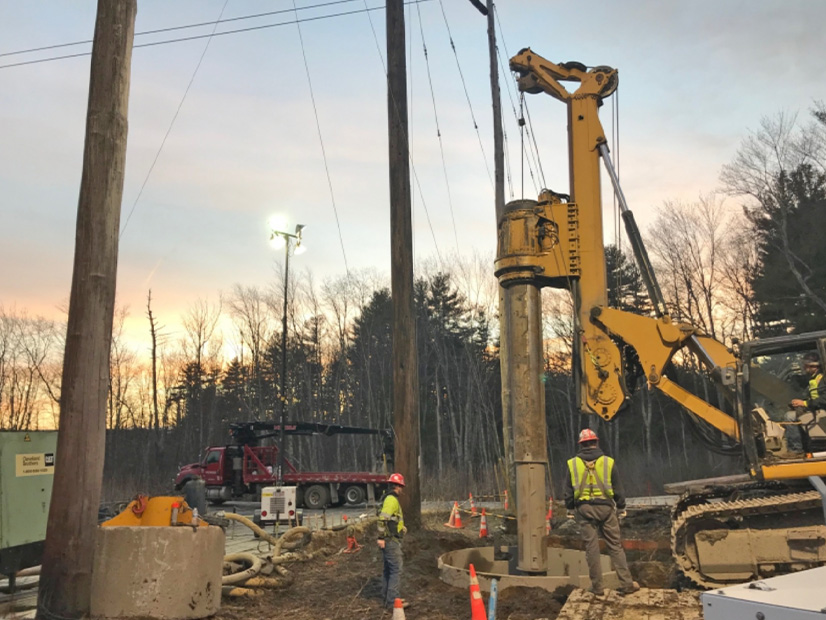 Construction of 345-kV transmission line foundations.