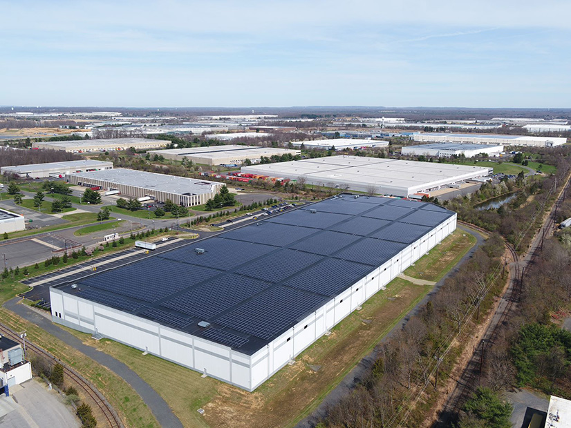 Together with panels on another Heitman warehouse in Monroe, N.J., the community solar panels installed on this warehouse in Dayton, N.J., will provide solar power to more than 1,500 households in nearby communities.