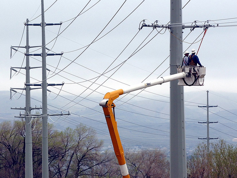Lineworkers on PacifiCorp transmission line