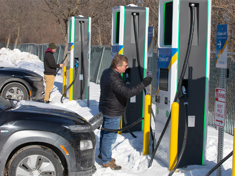 Electric vehicle owners charge up at a recently opened DC fast charging station in Plattsburg installed by the New York Power Authority under its EVolve NY program.