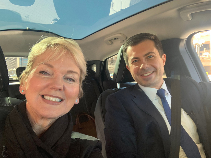 Energy Secretary Jennifer Granholm (left) and Transportation Secretary Pete Buttigieg head out to Takoma Park, Md., in a Ford Mustang Mach E on Dec. 14 to announce the launch of the Joint Office of Energy and Transportation.