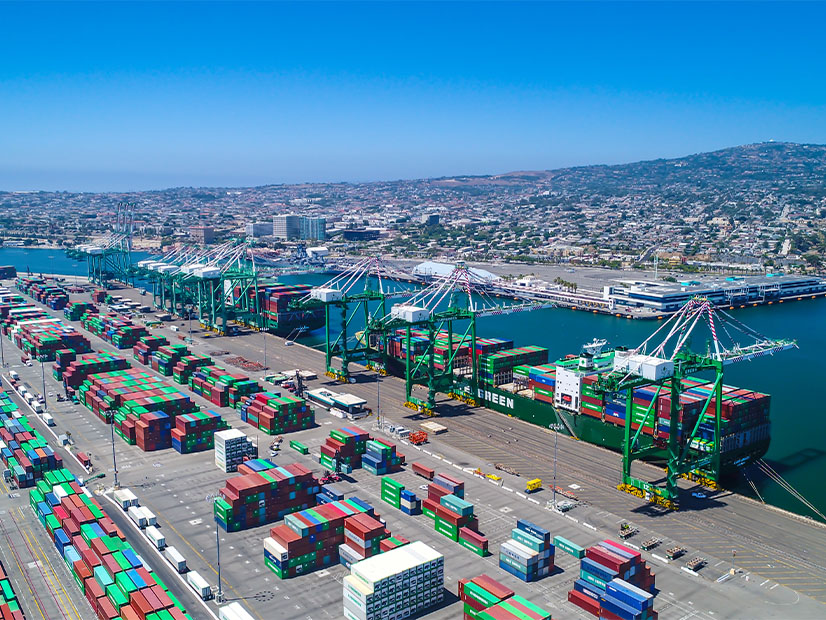 Port cranes line up at the Evergreen Cargo Terminal at the Port of LA. The company was the first to begin switching from on-board diesel-powered generators to power its electric motors to cranes using electricity directly from the grid.  The Port of LA is the largest of the nation's 360 seaports and ranked as the busiest.  Diesel has traditionally powered all port equipment as well as the hundreds of large trucks at the port to picking up or returning a container.  Managed and operated by the Los Angeles Board of Harbor Commissioners,  the Port of LA is moving toward electrification of all equipment — with fuel cells running on hydrogen to batteries to direct grid connection — in order to reduce carbon dioxide and other more noxious emissions.