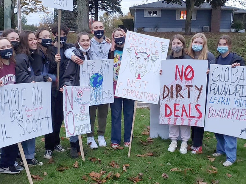 Vermont students rallied outside the gates of GlobalFoundries in Essex at the end of October in opposition of the company's request to operate as a utility that is exempt from state climate law.