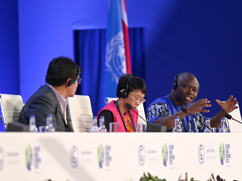From left, Magin Herrera Lopez, Mina Setra and Joseph Itongwa Mukumo speak at the Nature in Delivery of Paris Goals event at COP26 on Nov. 6. The greenhouse gas reduction pledges made just before the conference ...significantly... increase the chance that global warming can be limited to under 2 degrees Celsius by 2100, according to an analysis by the Pacific Northwest National Laboratory.