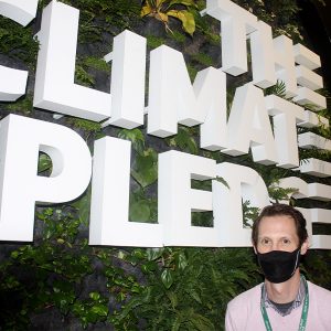 The Climate Pledge Arena's Rob Johnson in front of a "green wall" in the first subterranean level of the facility.