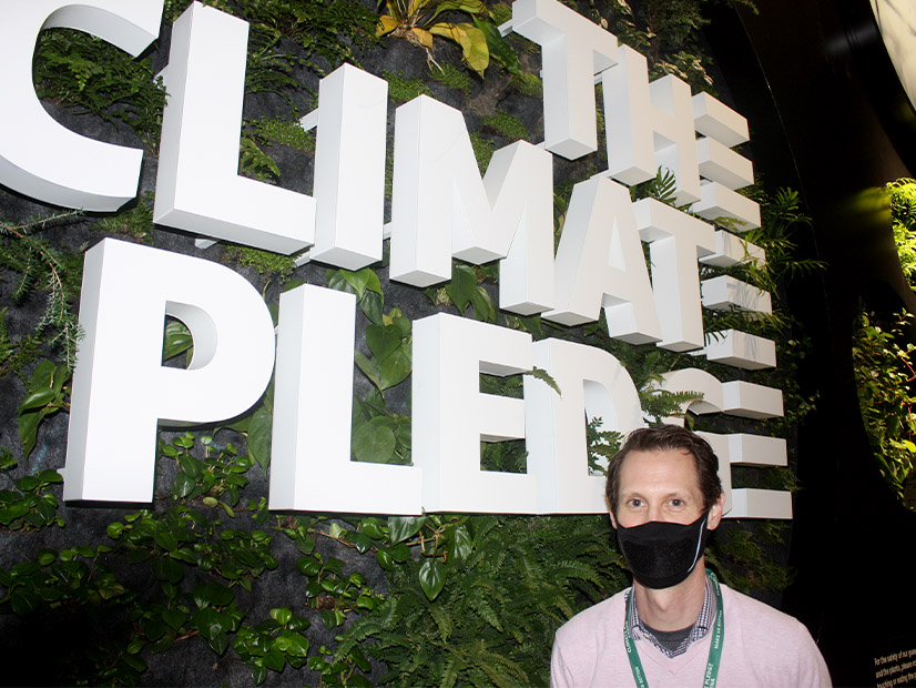 The Climate Pledge Arena's Rob Johnson in front of a "green wall" in the first subterranean level of the facility.