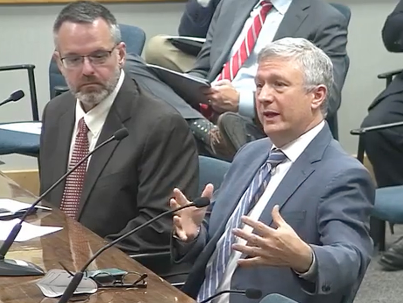 ERCOT's Dan Woodfin (left) and Kenan ..gelman brief the PUC on the grid operator's summer performance.
