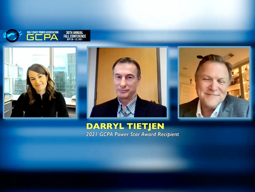 GCPA Board President Katie Coleman (l), Pat Wood (r) share a laugh with PUC's Darryl Tietjen as they honor him with the Pat Wood Power Star Award during the association's virtual fall conference.