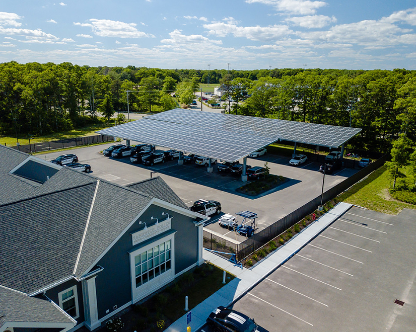A solar canopy project over the police station in Sandwich, Mass., coordinated by the Cape and Vineyard Electric Cooperative that went online in March of this year.