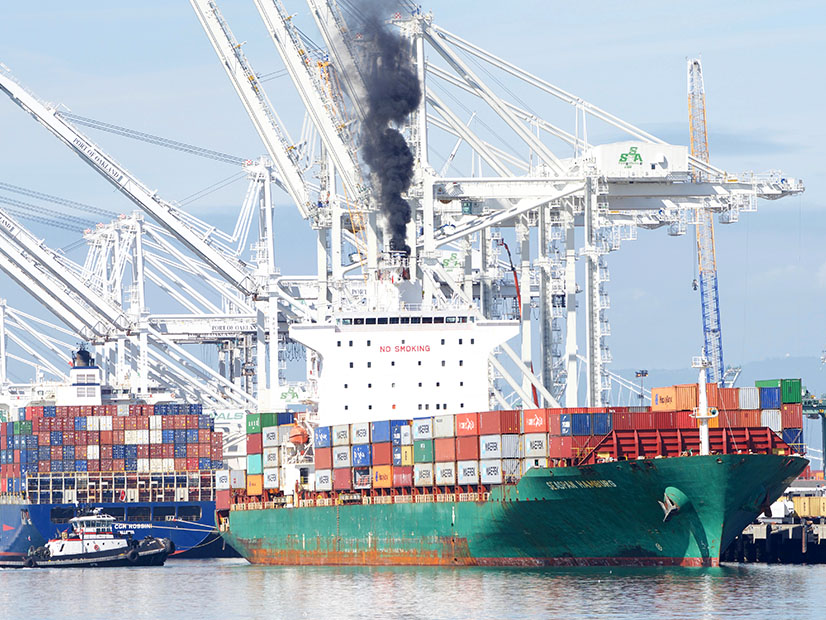A container ship spews diesel smoke in the Port of Oakland this year.
