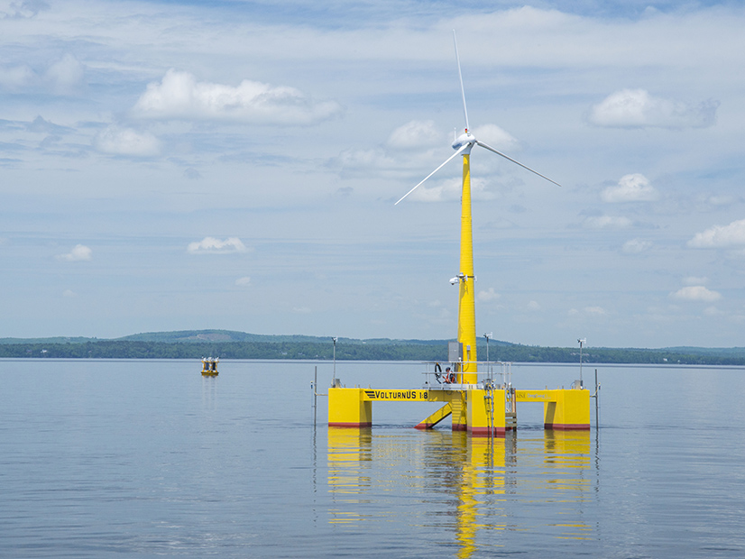 The one-eighth scale floating wind turbine designed as a test project by Maine researchers is shown along the coastline.