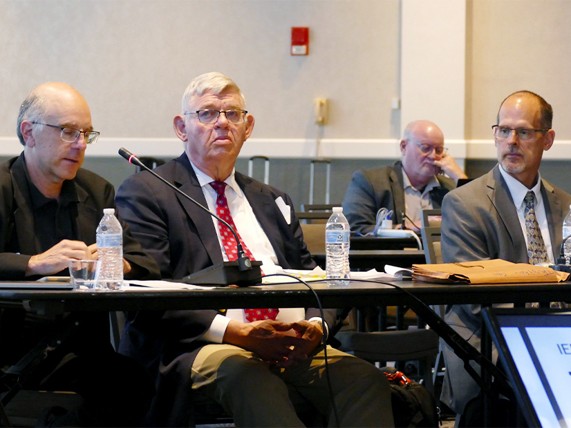 IEP Chair Mike Jacobs (left) explains the panel's recommendation as William Steele, Mike Schiavone listen. 