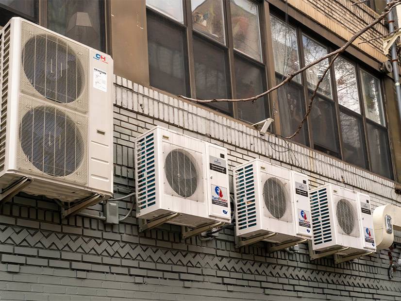 Heat pumps are shown outside a New York City building in 2022.