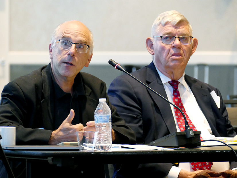 IEP's Mike Jacobs (left), William Steele during the July board meeting.