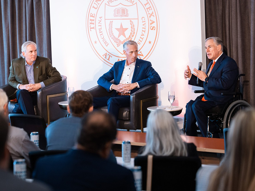 X-energy CEO Clay Sell (left) and Dow CEO Jim Fitterling (center) listen to Texas Gov. Greg Abbott during a fireside chat. 