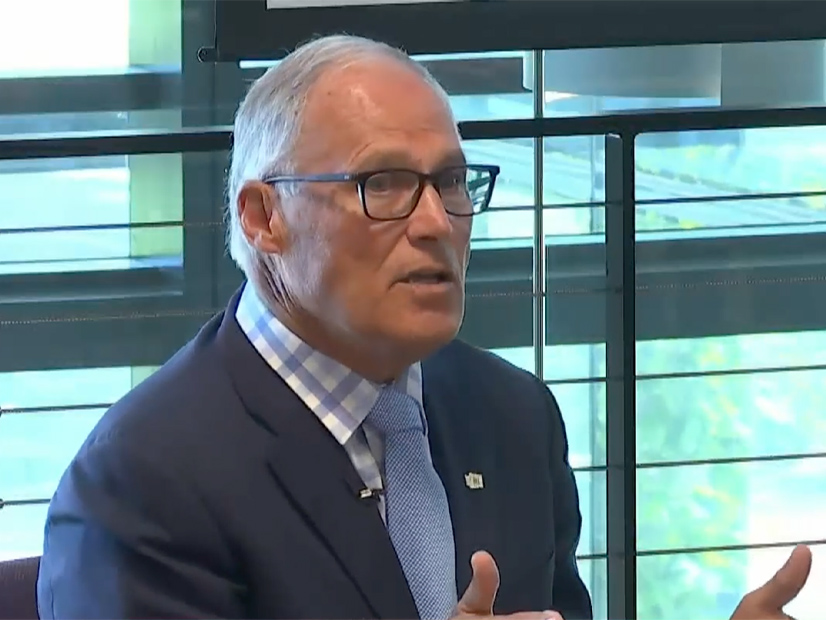 Gov. Jay Inslee led a panel discussion of climate experts from a classroom at the University of Washington.