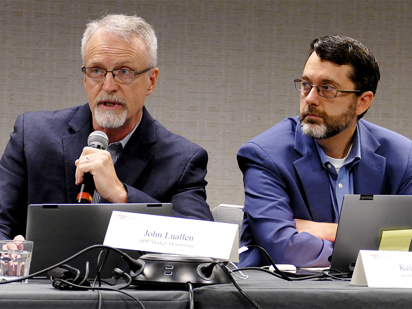 The SPP MMU's John Luallen (left) lays out the Monitor's objections to proposed accreditation policies as MMU Vice President Keith Collins listens. 