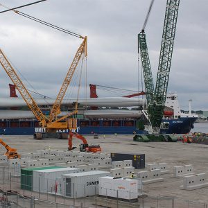 Offshore wind turbine blades are shown at a Connecticut port facility.