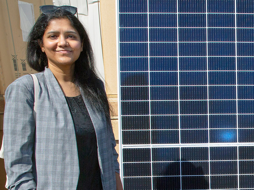 The New York Power Authority's new vice president of renewable project development, Venella Yadhati, stands with a solar panel near NYPA's headquarters in White Plains, N.Y.