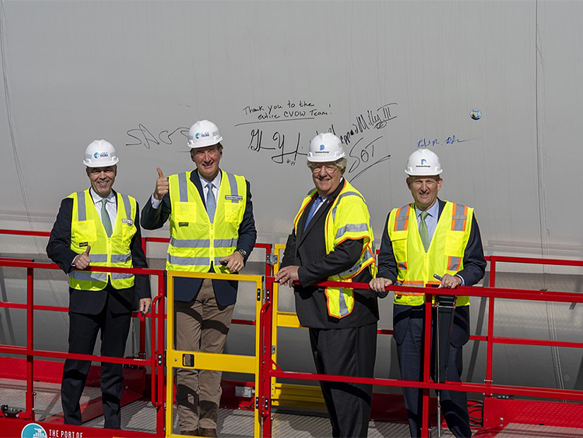 Port of Virginia CEO Stephen Edwards, Gov. Glenn Youngkin (R), Virginia Secretary of Transportation Shep Miller, and Dominion Energy CEO Robert Blue at a ceremony celebrating the first delivery of monopiles to the utility's offshore wind project.