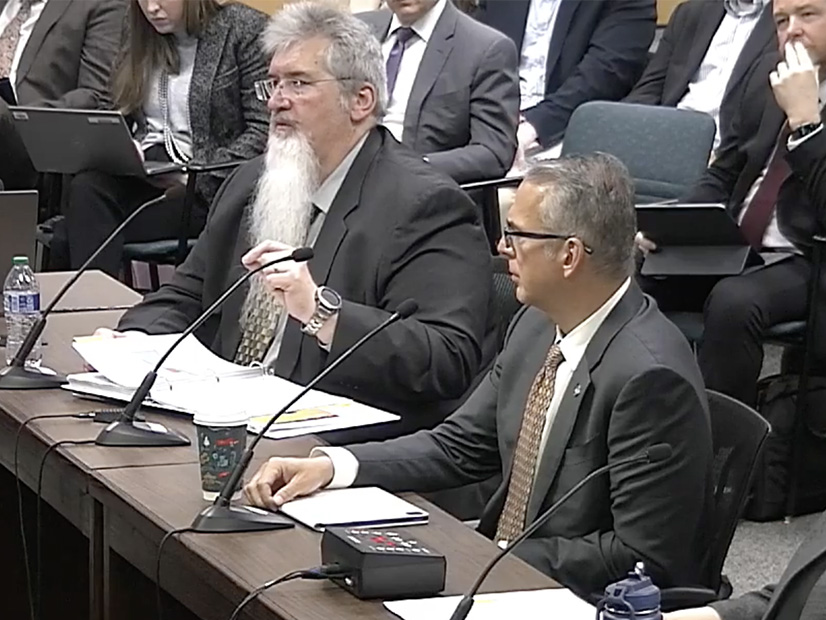 ERCOT CFO Sean Taylor (left), CEO Pablo Vegas review the ISO's budget with the Texas commission. 