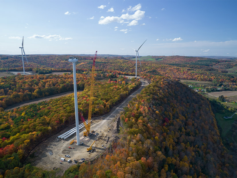 Crews work on a wind turbine in New York.