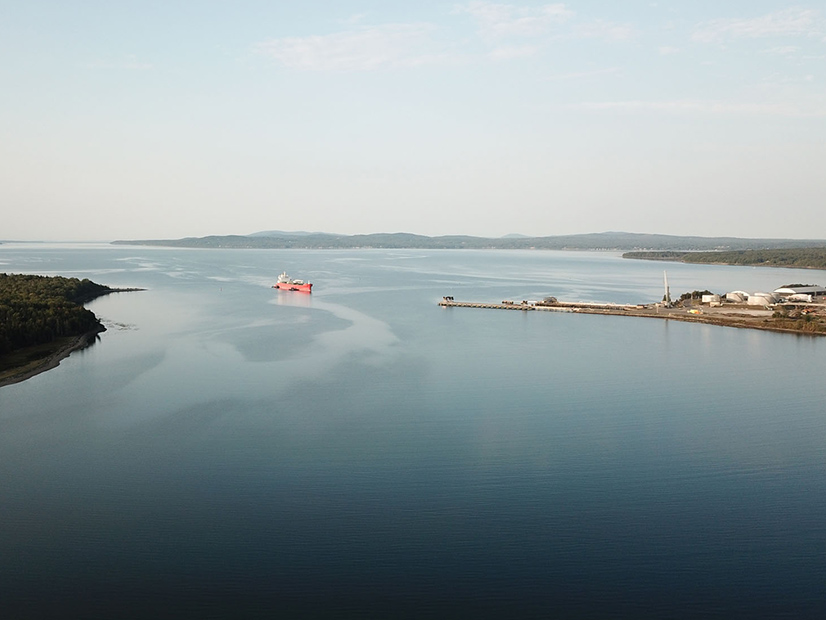 An aerial view of Penobscot Bay in Searsport, Maine, shows Sears Island on the left and an Irving petroleum terminal to the right. 