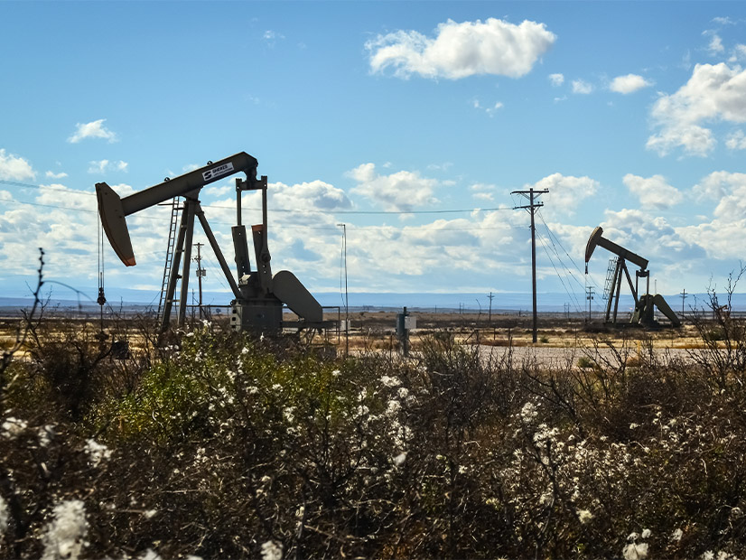 Oil production is shown in New Mexico. The U.S. Department of Interior has finalized new rules on renewable energy and fossil fuel production on public lands.