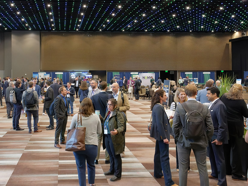 Attendees mingle during a break at NY-BEST’s Capture the Energy 2024 conference in Albany, N.Y., on May 15.