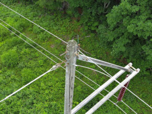 A cracked wooden pole on an Eversource transmission line in New Hampshire A cracked wooden pole on an Eversource transmission line in New Hampshire