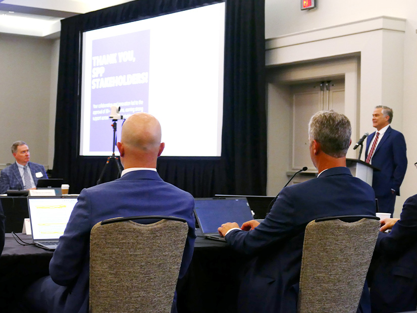 SPP's Casey Cathey (right) thanks everyone involved in developing the Consolidated Planning Process.