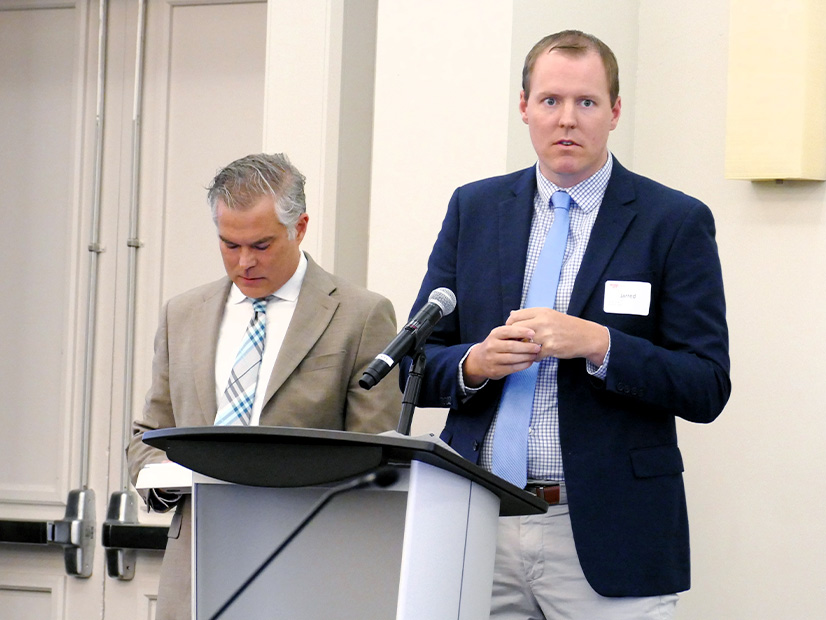 SPS' Jarred Cooley (right) explains why the company's estimate for a 765-kV project has more than doubled. 