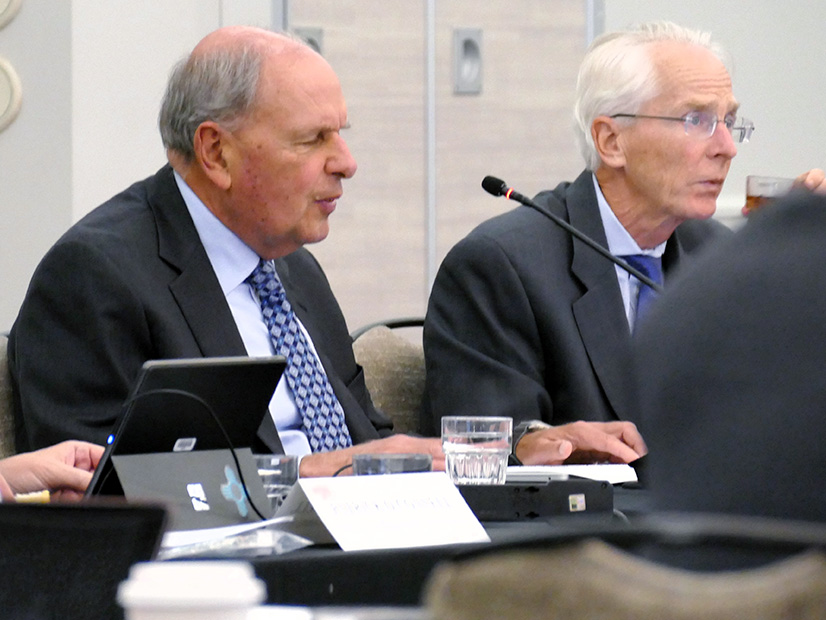 Ray Hepper (left) chairs the August board meeting. 