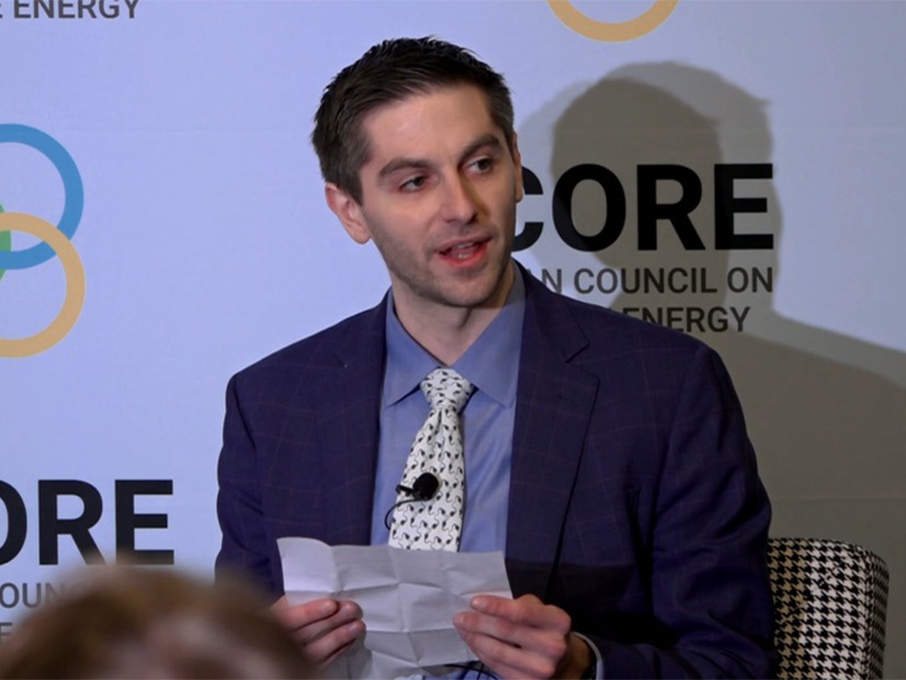 Arnold Ventures' Daniel Palken reads from the Simple Sabotage Field Manual at the ACORE Grid Forum on Oct. 23.
