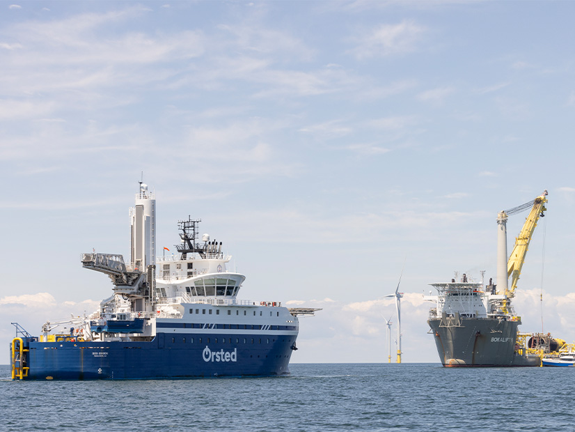 Ørsted's Eco Edison service operations vessel and the Bokalift 1 heavy lift vessel are shown at work on the Revolution Wind project off the New England coast Aug. 20.