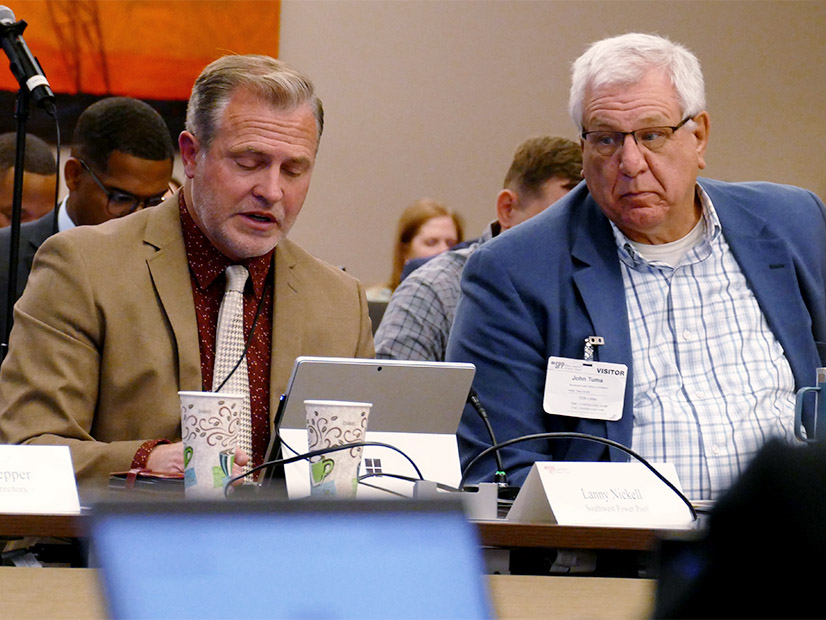 SPP CEO Lanny Nickell delivers the president's report as Minnesota's John Tuma listens.