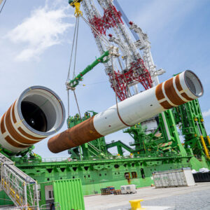Crews in Portsmouth, Va., load monopile foundations for Dominion’s Energy’s Coastal Virginia Offshore Wind, which would be the largest wind farm in U.S. waters. Crews in Portsmouth, Va., load monopile foundations for Dominion’s Energy’s Coastal Virginia Offshore Wind, which would be the largest wind farm in U.S. waters.
