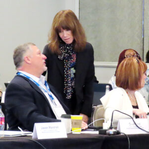 MSPPTF Chair Greg Ford (seated, left) talks with NERC Chair Suzanne Keenan at NERC's Board of Trustees meeting in Savannah, Ga. MSPPTF Chair Greg Ford (seated, left) talks with NERC Chair Suzanne Keenan at NERC's Board of Trustees meeting in Savannah, Ga.