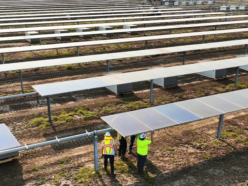 Technicians assemble a solar farm in Indiana in September 2025. Technicians assemble a solar farm in Indiana in September 2025.